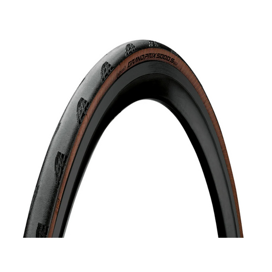 Continental Grand Prix 5000 S TR folding road bicycle tubeless tire displaying Lazer Grip shoulder tread blocks classic transparent tan sidewall casing and bold yellow Continental GP5000 brand markings - Epic Sports Kenya