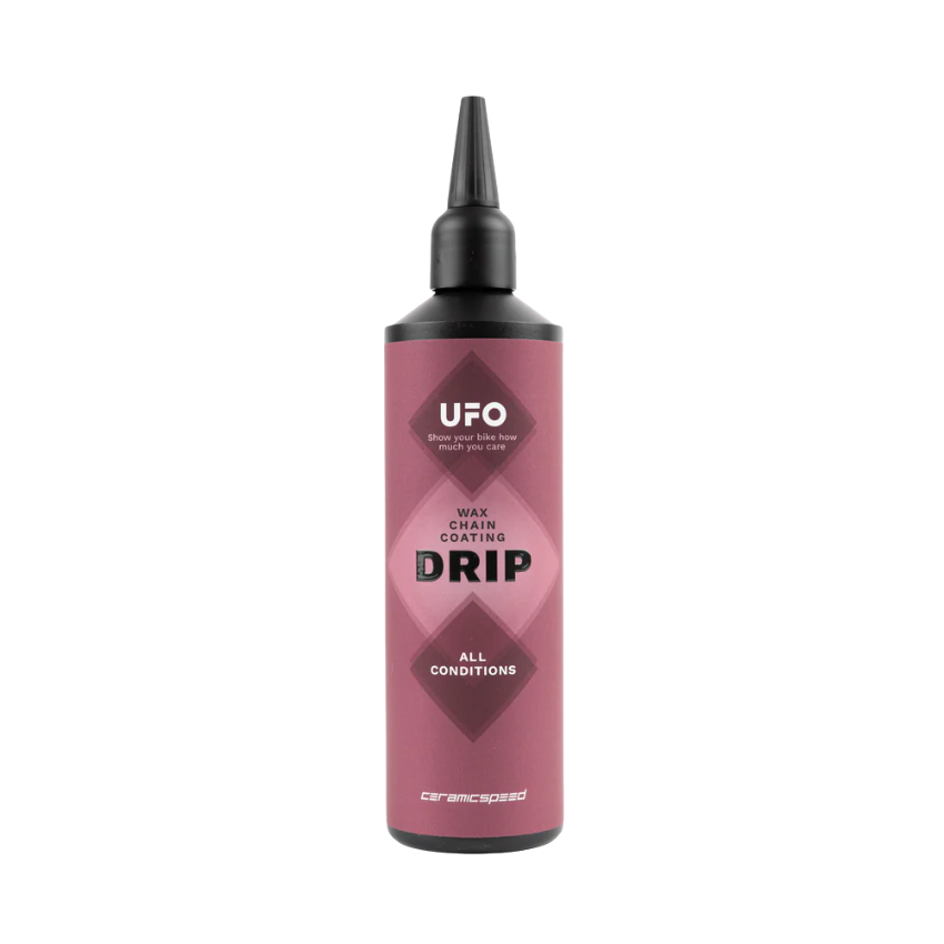 CeramicSpeed UFO Drip All Conditions chain coating large one hundred and eighty milliliter pro workshop bottle showing precise twist application tip low friction dry liquid wax formula text instructions and bold white branding layout - Epic Sports Kenya