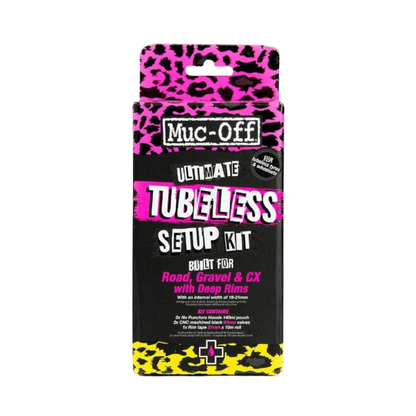 Muc-Off ultimate tubeless setup kit for road gravel and cyclocross wheels showing premium retail box contents including two pink sealant pouches rolls of pink rim tape two black anodized aluminum Presta valves with built in valve core removal caps and circular pink airtight seal patches - Epic Sports Kenya