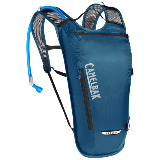 CamelBak Classic Light two liter trail hydration pack backpack showing minimalist ripstop nylon casing panels breathable 3D vent mesh shoulder harness straps front zippered tool organization pockets and blue Crux reservoir bladder drinking tube guide - Epic Sports Kenya
