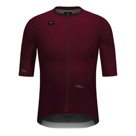 Gobik Magnitude mens short sleeve cycling jersey in Barossa deep wine burgundy displaying regular fit training cut extended length seamless bonded sleeves minimalist front waistband and exposed full zipper - Epic Sports Kenya