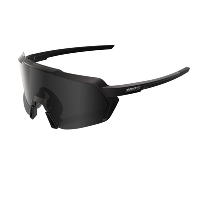 100 percent Korbin performance cycling sunglasses in Matte Black displaying their expansive 5.5 base cylindrical shield lens with premium Black Mirror tint shatterproof TR90 grilamid frame and non slip ultra grip rubber touchpoints - Epic Sports Kenya