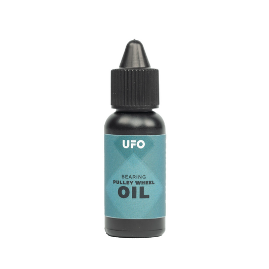 CeramicSpeed UFO bearing oil for derailleur pulley wheels fifteen milliliter small dropper bottle showing premium ultra low viscosity formula precision application tip clean branding text and dark cap for ospw maintenance - Epic Sports Kenya